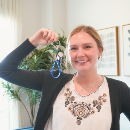 a woman holding a key