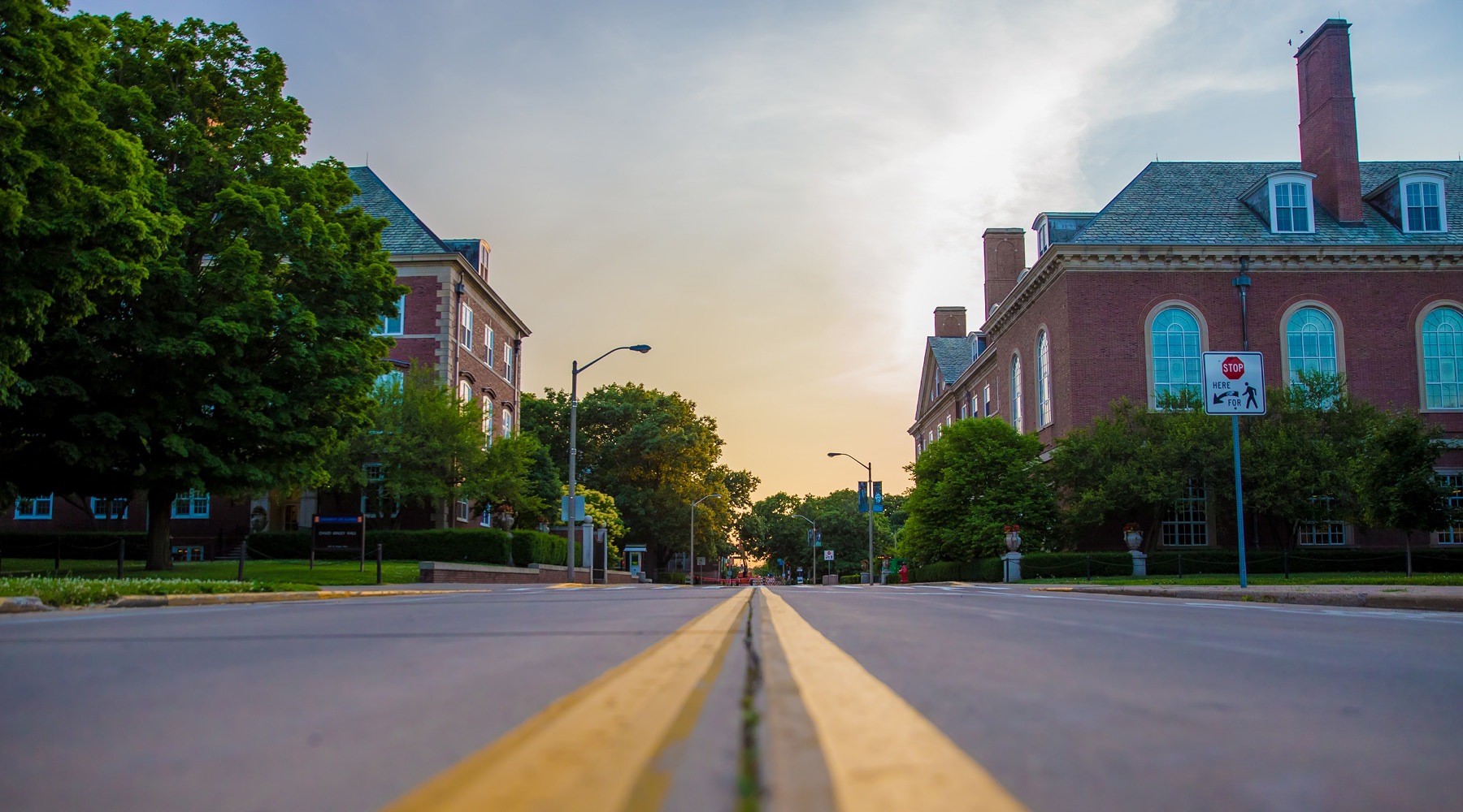 Be Part of a Legacy campus street flanked with class buildings